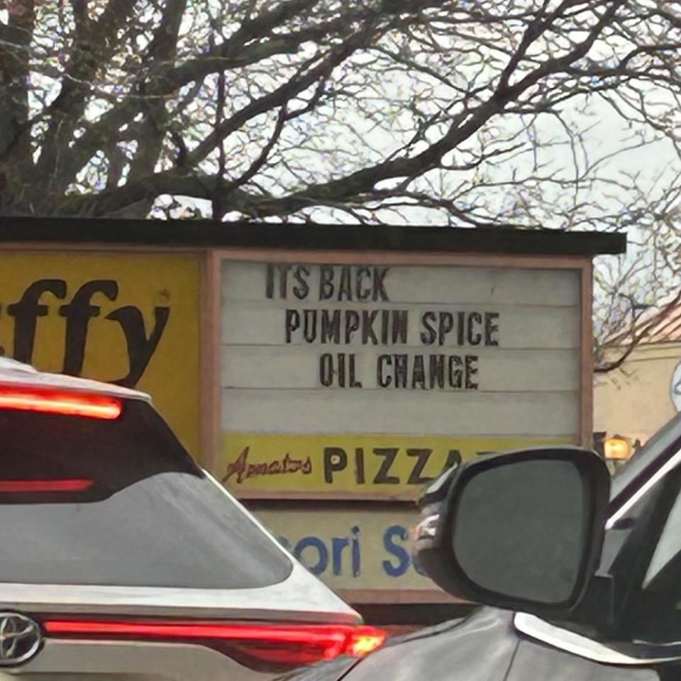 The store sign that says "The return of pumpkin spice oil"