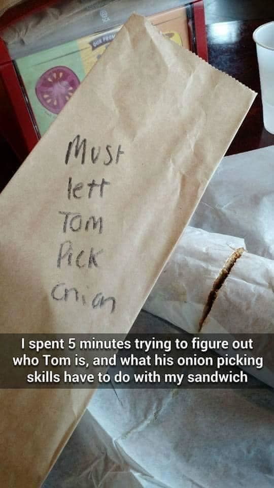 Takeout food bag with writing that says "I have to let him pick onions"